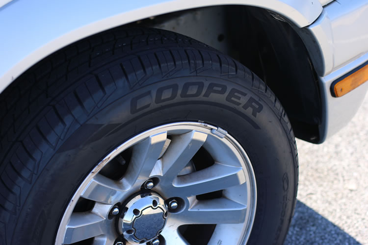 Cooper Tires review close-up showing tread depth pattern and groove design for wet weather traction after 35000 miles