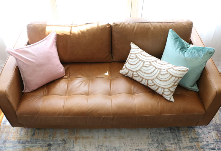 Overhead view of Article's most popular Sven leather sofa showing tufted bench seat