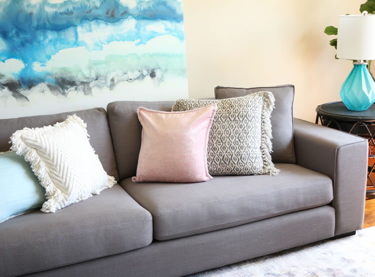 Lounging comfortably on the Article Sitka sofa - perfect for relaxation and laptop work