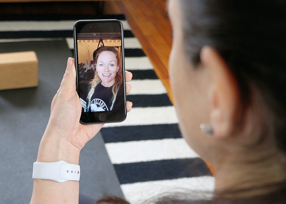 Having a facetime call with a personal fitness coach from Future to achieve fitness goals